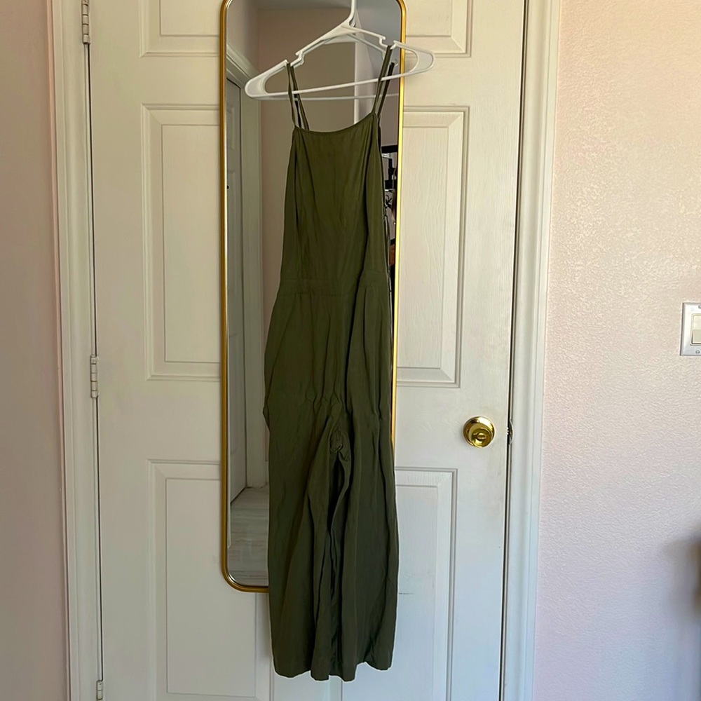Size 6 jumpsuit from Abercrombie & Fitch. It’s olive green and ties in the back